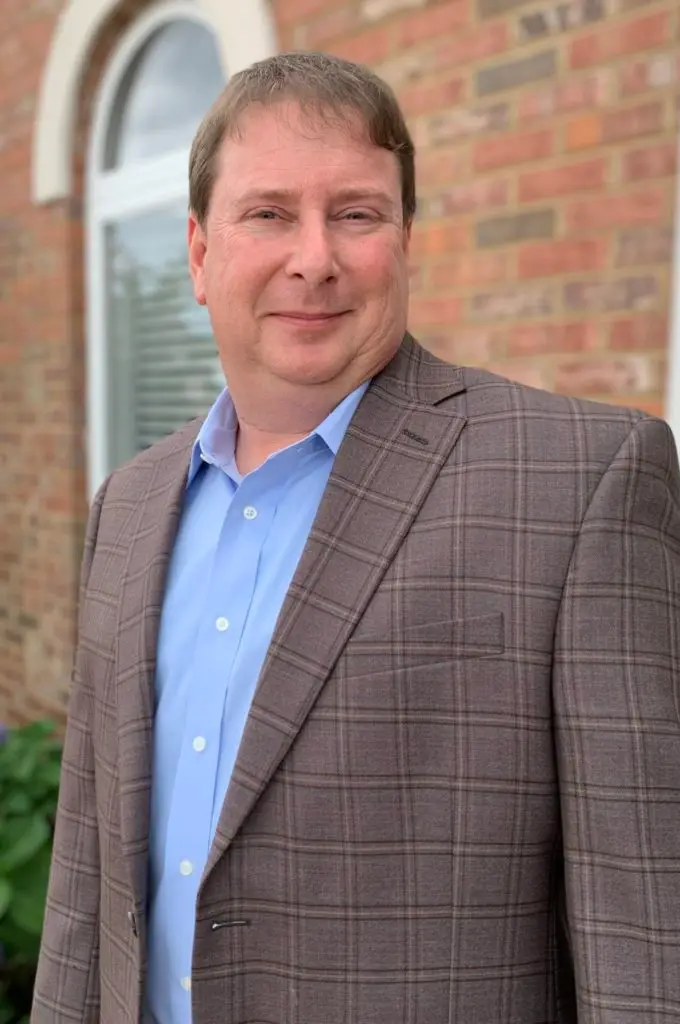 Richard Younger in front of Montgomery CPA office